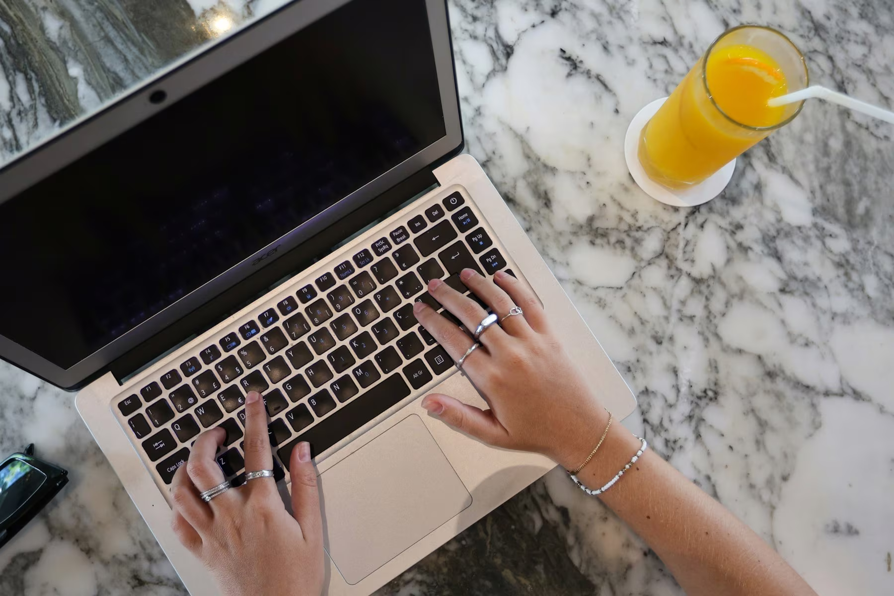 Sales operator researching AI workflows at a laptop
